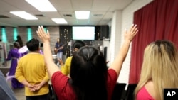 A congregant worships during services at Casa de Adoracion, Oct. 27, 2024 in Phoenix.
