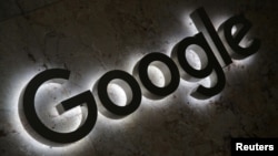 FILE - A Google logo is displayed at the entrance to the internet based company's offices in Toronto, Ontario, Sept. 9, 2018.