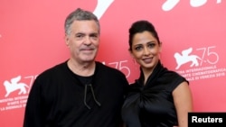 Director Amos Gitai and actor Maisa Adb Elhadi are pictured during a photo call for the films "A Letter to a Friend in Gaza" and "A Tramway in Jerusalem" at the 75th Venice International Film Festival, Sept. 3, 2018.