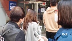  With Masks, Hand Sanitizer, and Gloves, South Koreans Vote During Pandemic