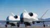 FILE - Two Northrop Grumman MQ-4C Triton unmanned aerial vehicles are seen on the tarmac at a Northrop Grumman test facility in Palmdale, Calif., May 22, 2013, in this handout photo provided by the U.S. Navy May 22, 2013.