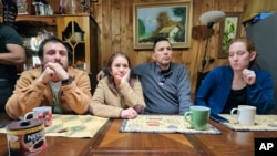 In this undated image provided by Constanza Del Rio/Nos Buscamos, Jimmy Thyden, second from right, sits with his wife, Johannah Thyden, right, his birth mother Maria Angelica Gonzalez, second from left, his brother Jonathan Gonzalez in Valdivia, Chile.