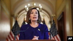 House Speaker Nancy Pelosi of Calif., reads a statement announcing a formal impeachment inquiry into President Donald Trump, on Capitol Hill in Washington, Sept. 24, 2019. 