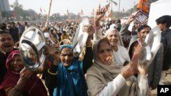 Supporters of India's main opposition National Democratic Alliance protest in the capital, New Delhi, Dec. 22, 2010.