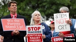 FILE - Opponents of the academic doctrine known as critical race theory protest outside of the Loudoun County School Board headquarters, in Ashburn, Virginia, June 22, 2021.