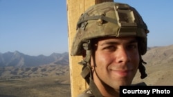 Sergeant Devin Burgett of Iowa City, Iowa, who served in Afghanistan from 2010 to 2011, says he would back a candidate who supports staying in Afghanistan to try to help the Afghan people. 