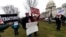 Activists gather on the East Front of the Capitol after the impeachment acquittal of President Donald Trump, on Capitol Hill, Feb. 5, 2020 in Washington.