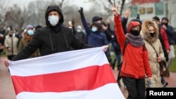 Belarusian opposition supporters attend a rally to reject the presidential election results in Minsk, Belarus, Nov. 22, 2020. 