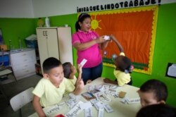 Teacher Daixy Aguero teaches a class at a school in Caracas, Venezuela, Oct. 7, 2019.