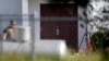 FILE - Bullet holes were marked by police at the front of the building as law enforcement officials continue to investigate the scene of a shooting at the First Baptist Church of Sutherland Springs in Sutherland Springs, Texas, Nov. 7, 2017.