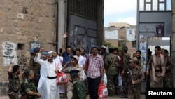This image grab taken from a handout video released by Ansarullah, the Houthi rebels fighting the Saudi coalition in Yemen, on Sept. 29, 2019, allegedly shows detained men described by the Iran-backed group as captured pro-government fighters.