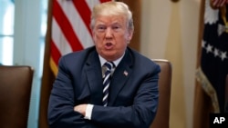 President Donald Trump speaks during a cabinet meeting at the White House, May 9, 2018, in Washington.