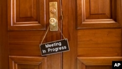 A sign hangs on the Senate Appropriations Committee room at the Capitol as bipartisan House and Senate bargainers trying to negotiate a border security compromise in hope of avoiding another government shutdown, in in Washington, Feb. 11, 2019.