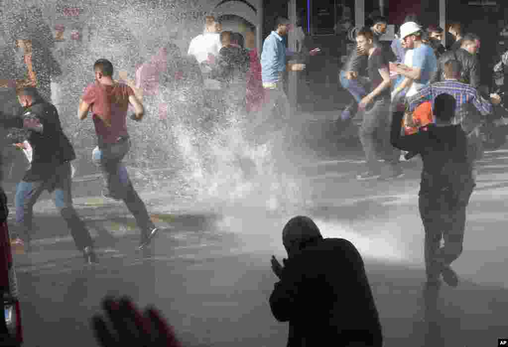 A police water cannon is used against anti-government protesters in Soma, Turkey, May 16, 2014.