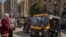 Toktoks are waiting for passengers at the subway station of Sayeda Zaynab in old Cairo. (H. Elrasam/VOA)