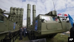 FILE - Russian air defense missile systems are displayed at the MAKS Air Show in Zhukovsky, outside Moscow, Aug. 27, 2013.