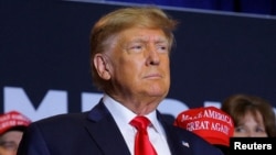 FILE - Former U.S. President and Republican presidential candidate Donald Trump attends a campaign event in Manchester, New Hampshire, April 27, 2023. 