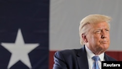 FILE - U.S. President Donald Trump delivers a speech during a tour of the Double Eagle Energy Oil Rig in Midland, Texas, July 29, 2020.