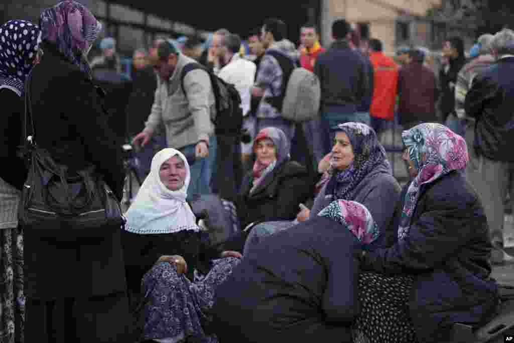 Family members wait outside a coal mine in Soma, western Turkey, May 14, 2014.