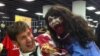 A man holds a zombie doll at the Walker Stalker convention in Atlanta, Georgia. (Marissa Melton for VOA)