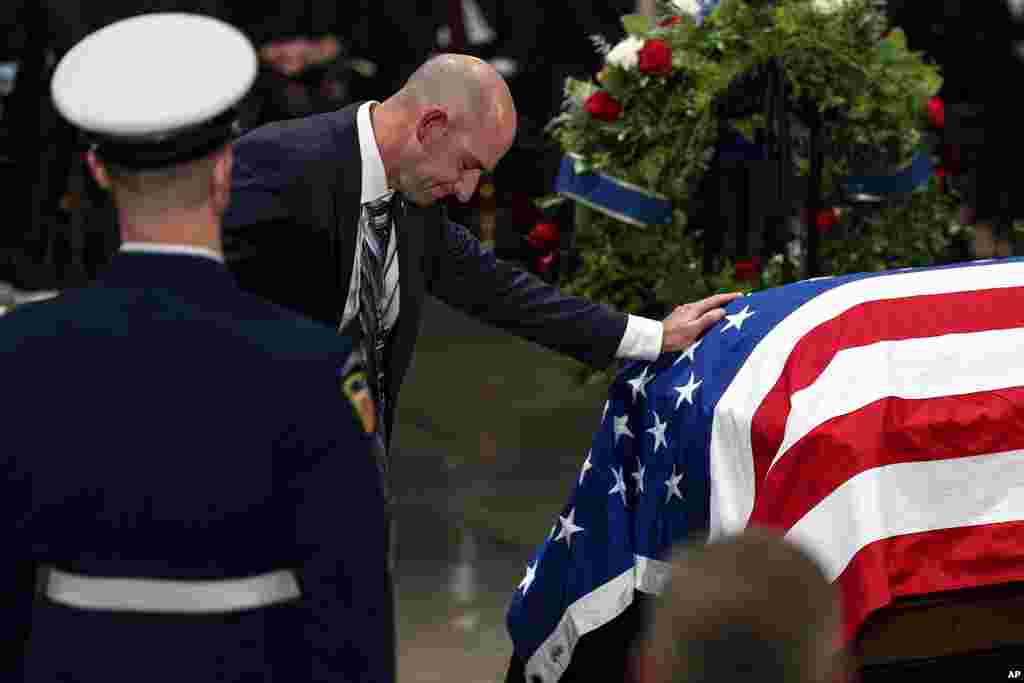 The Carter family pay their respects during a ceremony as the flag-draped casket of former President Jimmy Carter lies in state, at the Capitol, in Washington, Jan. 7, 2025.