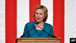 FILE - In this Friday, July 31, 2015, Democratic presidential candidate, former Secretary of State Hillary Rodham Clinton, calls on Congress to end the trade embargo the U.S. has imposed against Cuba since 1962, during a campaign stop at Florida International University in Miami. Clinton is airing the first television ads of her presidential race, which are scheduled for Aug. 4, 2015.