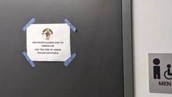 n this Sept. 17, 2021 photo courtesy of Cuyler Dunn shows a sign on a closed restroom at Lawrence High School in Lawernce, Kan. 