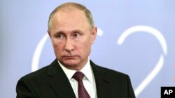 FILE- Russian President Vladimir Putin speaks to the media after the G-20 summit in Buenos Aires, Argentina, Dec. 1, 2018.