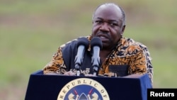 FILE - Gabon's President Ali Bongo addresses reporters at Nairobi National Park near Nairobi, Kenya, April 30, 2016.