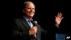 Democratic senatorial candidate Doug Jones speaks during a "get out the vote rally," Dec. 9, 2017, in Birmingham, Ala.