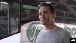 File - Australian Broadcasting Corp. journalist Bill Birtles speaks to the media at Sydney airport, Australia Sept. 8, 2020, when he and the Australian Financial Review journalist Michael Smith, left China after police demanded interviews with them.