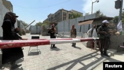 Members of Taliban forces keep watch at a check point in Kabul, Afghanistan, August 17, 2021. 