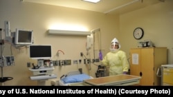 Workers must wear protective gear to care for patients with Ebola or other infectious disease in the NIH Clinical Center's high containment unit. (Photo courtesy of the U.S. National Institutes of Health)