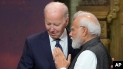 FILE - U.S. President Joe Biden, left, and India Prime Minister Narendra Modi talks during the G20 leaders summit in Nusa Dua, Bali, Indonesia, Nov. 15, 2022.