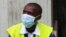 Airport worker in Abidjan wear protection from the spread of the Ebola virus disease in Abidjan, August 12. 