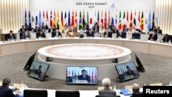 Perdana Menteri Jepang Shinzo Abe berbicara selama KTT G20 di Osaka, Jepang pada 29 Juni 2019. (Foto: Kazuhiro Nogi via Reuters)