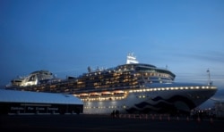 The cruise ship Diamond Princess, where more than 60 people have tested positive for coronavirus so far, is seen at Daikoku Pier Cruise Terminal in Yokohama, south of Tokyo, Feb. 7, 2020.