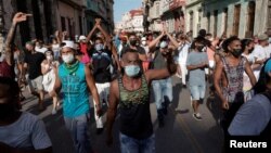 FILE - People shout slogans against the government during a protest in Havana, Cuba, July 11, 2021. 