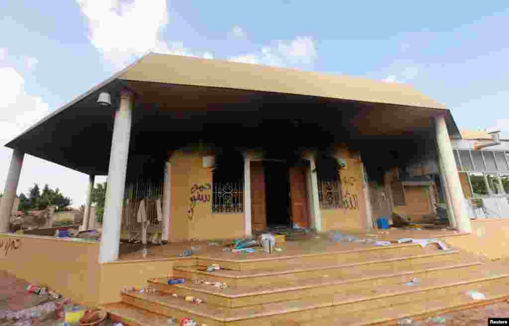 Typhoon survivor Manolito Pacurib stands inside his damaged home near a shipping vessel that remains grounded after being washed ashore during Typhoon Haiyan, in Tacloban, Philippines, Dec. 23, 2013.&nbsp;