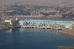 FILE - A general view shows the Tishrin Dam, east of Aleppo, Syria, Dec. 27, 2015.