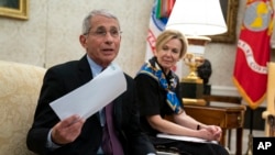 White House coronavirus response coordinator Dr. Deborah Birx listens as Director of the National Institute of Allergy and Infectious Diseases Dr. Anthony Fauci, left, speaks at the White House, April 29, 2020, in Washington.