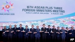 FILE - ASEAN foreign ministers pose for group photo in Kuala Lumpur, Malaysia, Aug. 6, 2015. 