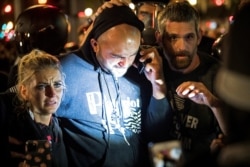 FILE - Joey Gibson, leader of the right wing Patriot Prayer group, arrives at the scene of a shooting amid weekend street clashes between supporters of President Donald Trump and counterdemonstrators in Portland, Oregon, Aug. 29, 2020.