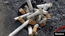 Cigarette butts are seen in an ashtray in Los Angeles, California, May 31, 2012. 