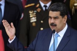 FILE - Venezuela's President Nicolas Maduro speaks during a news conference at Miraflores Palace in Caracas, March 12, 2020.