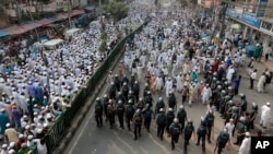 FILE - Bangladeshi activists of several Islamic groups attend a protest rally against the persecution of Rohingya Muslims in Myanmar, after Friday prayers in Dhaka, Bangladesh, Nov. 25, 2016. 