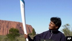 FILE - Then-Australian Olympic sprinter Nova Peris is seen in this June 7, 2000 file photo. She later became the first Aboriginal woman to win a seat in Australia's Parliament. 