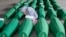 A girl inspects coffins prepared for burial, in Potocari near Srebrenica, Bosnia. The remains of 33 victims of Srebrenica massacre will be buried on July 11, 2019, 24 years after Serb troops overran the eastern Bosnian Muslim enclave of Srebrenica and executed some 8,000 Muslim men and boys.