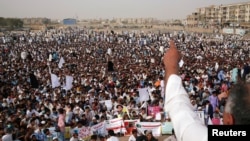 Members of Pakistan's Pashtun community, listen to one of their leaders during a rally against, what they say, are human rights violations, organized by the Pashtun Tahaffuz Movement (PTM) in the southern city Karachi, Pakistan, May 13, 2018. 