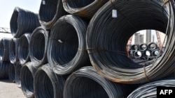 FILE - Rolls of steel are seen at a steel market in Fuyang, in Chinas eastern Anhui province on Feb. 10, 2025.